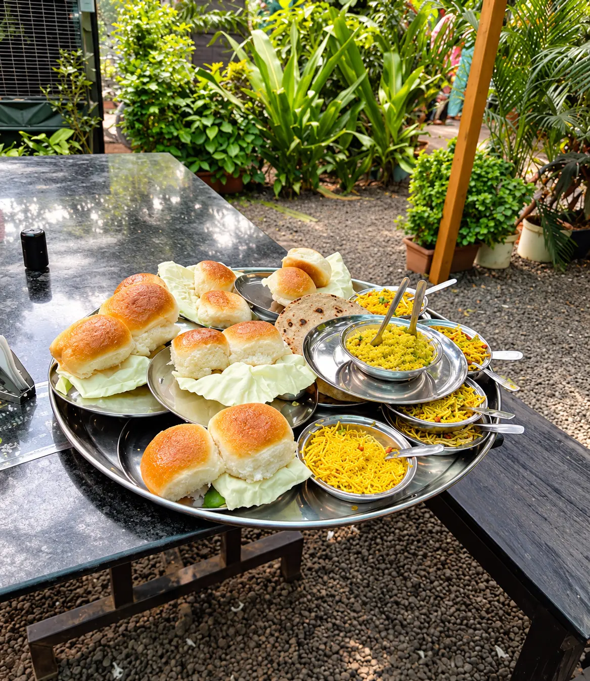 Misal pav plates and sides served in the garden
