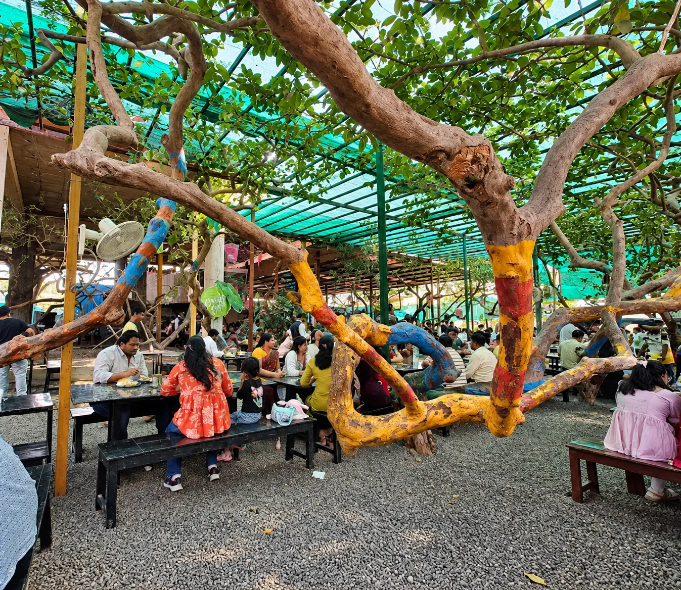 Painted tree branches over granite dining tables